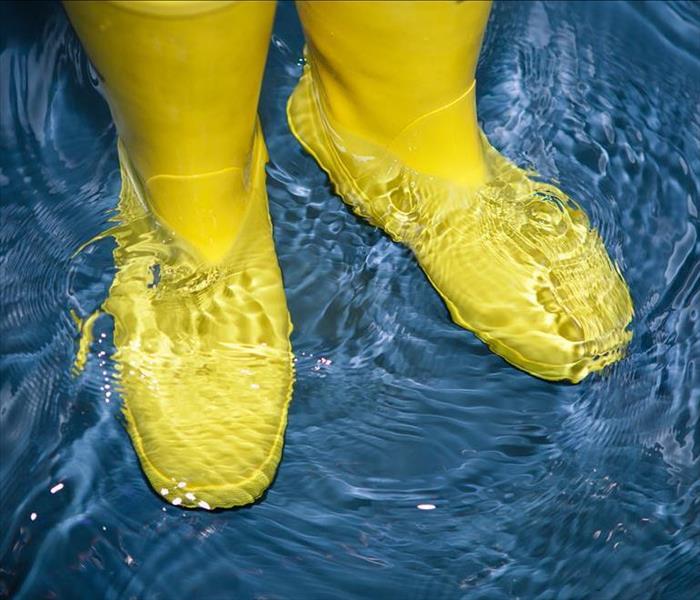 Water boots standing in water